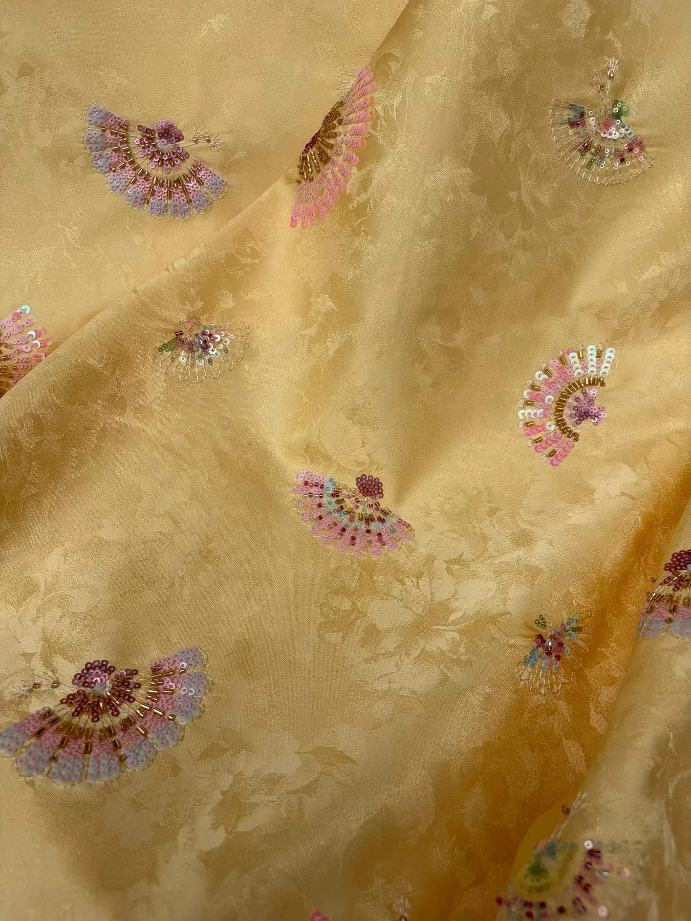Gold embellished embroidered fabric