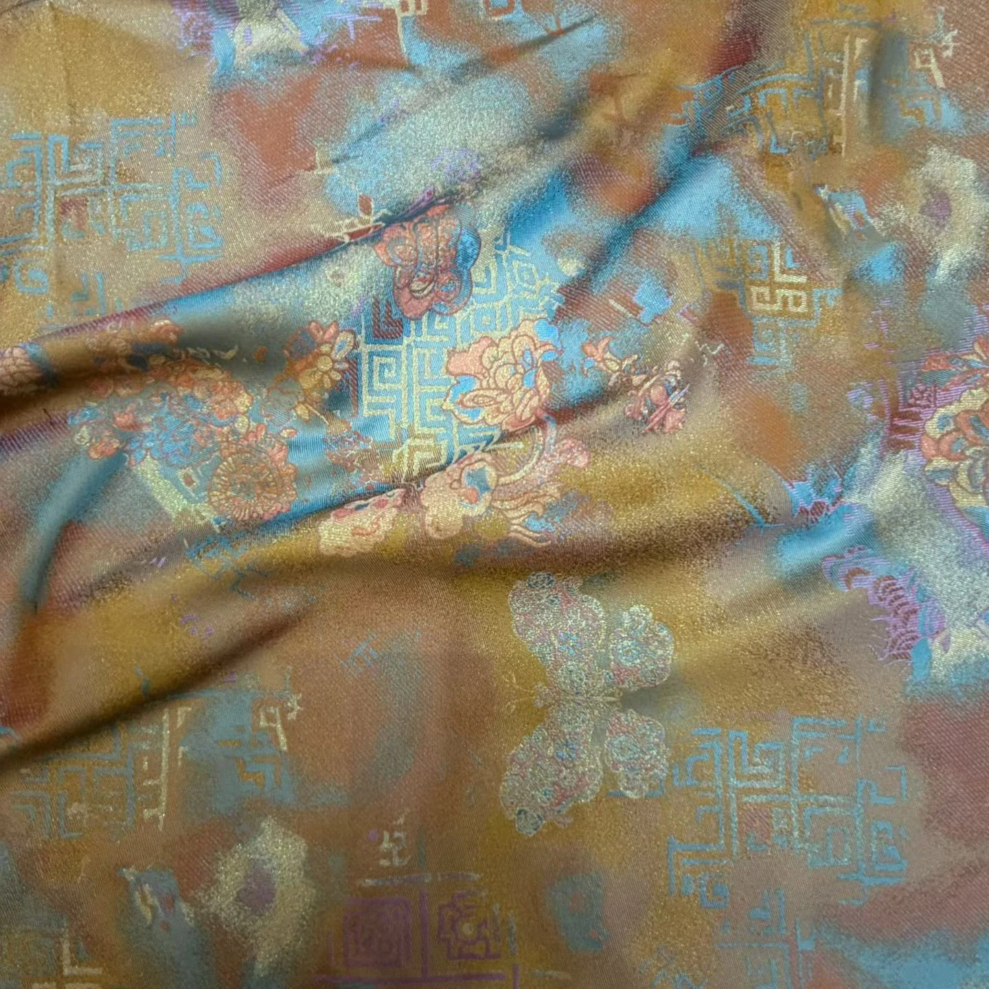 Tejido jacquard bronce y azul